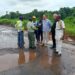 Bea Mountain and Ministry of Public Works officials inspect rehabilitation works on the Bomi–Monrovia highway amid muddy road conditions and construction equipment