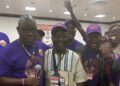 Bong County lawmakers Moye, Cole, and Kollie smile and embrace during reconciliation at the UBCAA diaspora convention in Kentucky