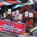 Members of the CDC Youth League hold banners and placards in a crowded street rally endorsing the July 17 “Enough is Enough” protest in Monrovia.