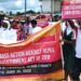 Protesters in Gbarnga march against the repeal of key sections of the 2018 Local Government Act holding banners and placards