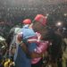 Christoph the Change kisses his wife on stage in front of a massive crowd at SKD Stadium during his historic Independence Day concert, capturing an emotional moment of love, victory, and cultural pride.