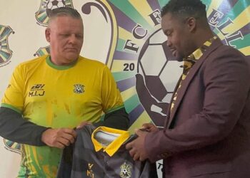 FC Fassell official presents club jersey to Belgian coach Ivan Minnaert during his unveiling ceremony in Monrovia before their contract dispute.
