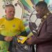 FC Fassell official presents club jersey to Belgian coach Ivan Minnaert during his unveiling ceremony in Monrovia before their contract dispute.