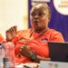 Zambian coach Florence Mwila participates in a CAF A Coaching Diploma session in Monrovia, Liberia, wearing a red training jersey with the Liberia Football Association logo.