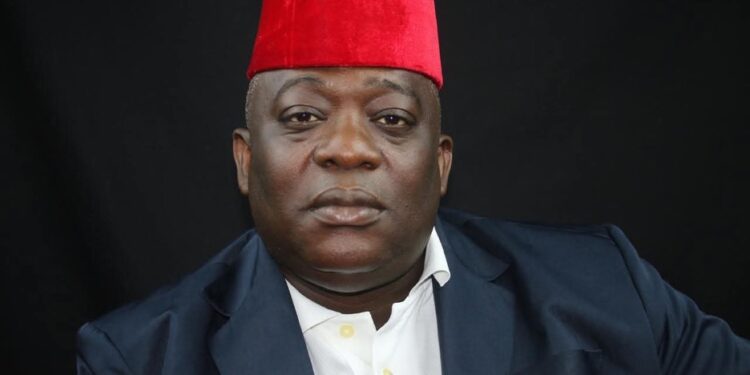 Montserrado County Rep. Bernard Blue Benson Jr. in traditional red cap calling for LFA District League suspension