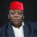 Montserrado County Rep. Bernard Blue Benson Jr. in traditional red cap calling for LFA District League suspension