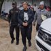 LDEA officers escort Liberian businesswoman Quita Dolo Kosso in handcuffs after her arrest for trafficking US$181K worth of cocaine from Bangkok at Roberts International Airport