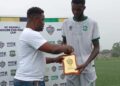 FC Fassell defender receives Man of the Match award at the Soccer for Peace Cup