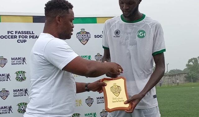 FC Fassell defender receives Man of the Match award at the Soccer for Peace Cup