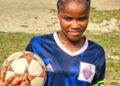Gabrielle Lines, teenage striker and Republic FC captain, poses in her blue jersey holding a soccer ball before her tragic death