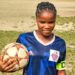 Gabrielle Lines, teenage striker and Republic FC captain, poses in her blue jersey holding a soccer ball before her tragic death