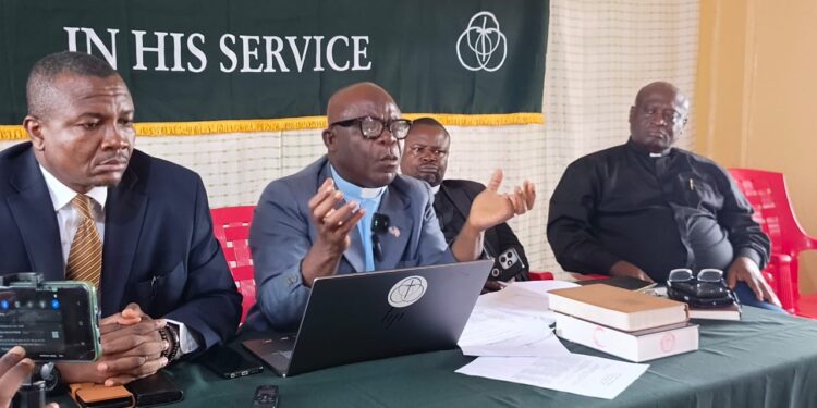 Rev. Dr. Jerry Kulah of the Global Methodist Church addresses journalists during a press briefing on the church’s plan to build 241 congregations across Liberia by 2028.