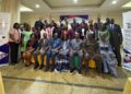 Group photo of ILO, ECOWAS officials, journalists, and partners at Abuja workshop on labor migration and decent work