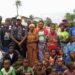 Former Ivorian refugees pose with LRRRC officials during residence permit campaign in Zwedru, Grand Gedeh County, Liberia.