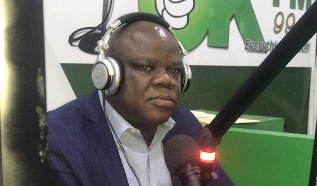 Christopher D. Sankolo, suspended Director General of LACRA, speaks during a radio interview at OK FM amid financial misconduct allegations related to a UBA account.
