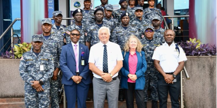 Group photo of Liberia Revenue Authority anti-smuggling officers with IMF experts Kevin Atkison and Jacqueline Penfold at the launch of a customs training mission in Monrovia