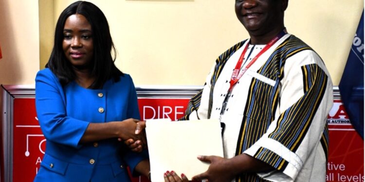 LACC Chairperson Cllr. Alexandra Zoe and LRA Commissioner General James Dorbor Jallah shake hands after announcing 100% asset declaration compliance