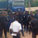 Liberia National Police officers receive briefing during deployment ceremony in Nimba County