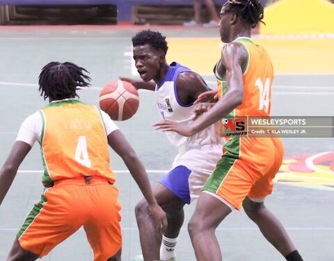 Liberia U-16 guard drives between two Benin defenders during a 98-38 victory at the FIBA AfroBasket Zone 3 qualifiers in Paynesville
