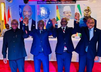 Speakers of Parliament from Mano River Union member states, including Liberia's Speaker J. Fonati Koffa (second from right), join hands in solidarity during a high-level meeting to strengthen regional cooperation on security, governance, and legislative oversight
