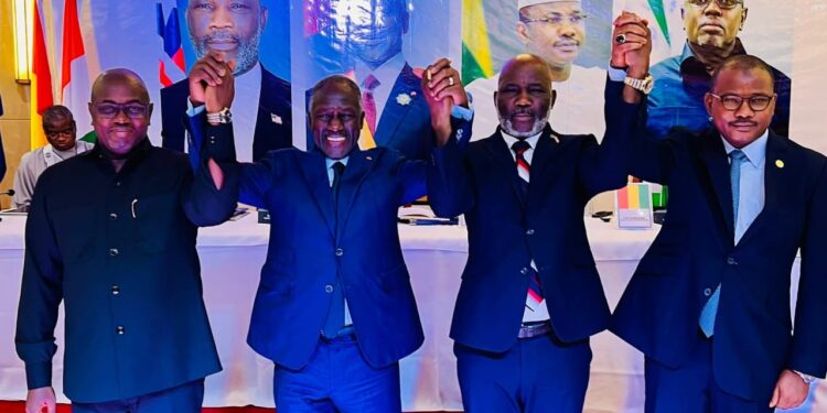 Speakers of Parliament from Mano River Union member states, including Liberia's Speaker J. Fonati Koffa (second from right), join hands in solidarity during a high-level meeting to strengthen regional cooperation on security, governance, and legislative oversight
