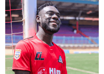 Liberian forward Mark Yallah smiles in his new Vipers SC jersey after completing his move to the Ugandan football champions.