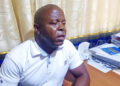 NEC Upper Nimba Magistrate Milton Paye discusses voter card replacement statistics in his Sanniquellie office