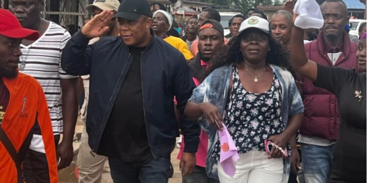 STAND leader Mulbah Morlu marches with supporters through Monrovia streets ahead of the planned July 17 protest calling for justice and democratic reforms in Liberia.