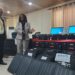NEC Chairperson Davidetta Browne Lansanah presents biometric voter registration kits to NIR Executive Director Andrew Peters during official handover in Monrovia