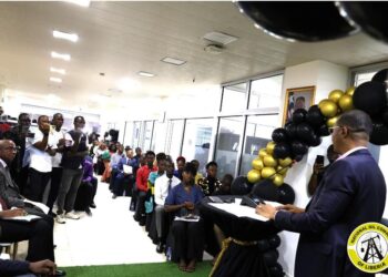 NOCAL President Fabian M. Lai speaks at scholarship award ceremony attended by students, officials, and family members in Monrovia