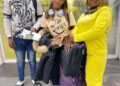 Three NaFAA staff members at an airport en route to China for a fisheries value chain training program aimed at enhancing Liberia’s fishery sector.