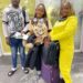 Three NaFAA staff members at an airport en route to China for a fisheries value chain training program aimed at enhancing Liberia’s fishery sector.