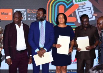 Executives from Orange Money, LRA, and Ecobank Liberia pose with signed agreements during the July 23, 2025 MOU ceremony enabling mobile tax payments across 18 government ministries.