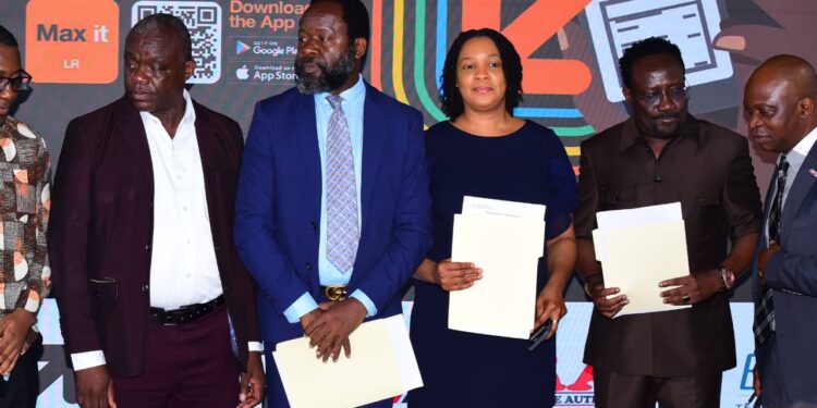 Executives from Orange Money, LRA, and Ecobank Liberia pose with signed agreements during the July 23, 2025 MOU ceremony enabling mobile tax payments across 18 government ministries.