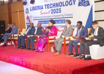 Panelists, including private sector and government leaders, seated on stage during Liberia Technology Summit 2025 in Monrovia, themed “Transforming Governance, Empowering Citizens.”
