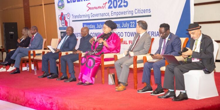 Panelists, including private sector and government leaders, seated on stage during Liberia Technology Summit 2025 in Monrovia, themed “Transforming Governance, Empowering Citizens.”