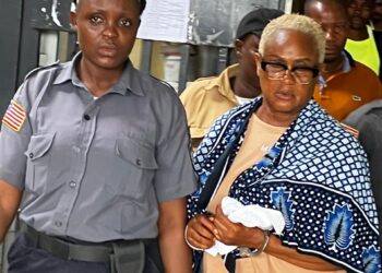 Rita Sarta William escorted by prison officer after being sentenced for drug trafficking at Criminal Court C in Monrovia