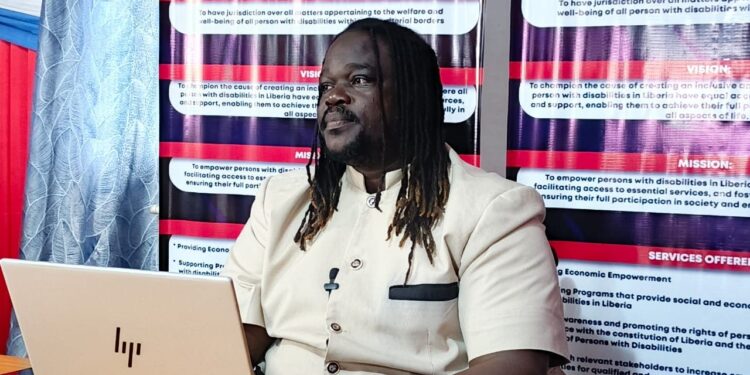 Samuel Dean, Executive Director of Liberia’s National Commission on Disabilities, speaks during post-UN CRPD Conference briefing in Monrovia