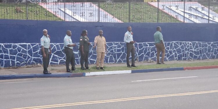 Liberia’s Senate Sergeants-at-Arms stand along Capitol Hill without transportation, reflecting years of neglect and systemic underfunding by lawmakers.