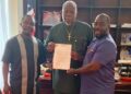Senator Bill Twehway receives appointment letter as board chair of Senior Female Professionals FC from club officials at his Capitol Building office.