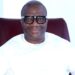 MPC leader Simeon Freeman smiling in white attire while advocating for 4-year political terms in Liberia