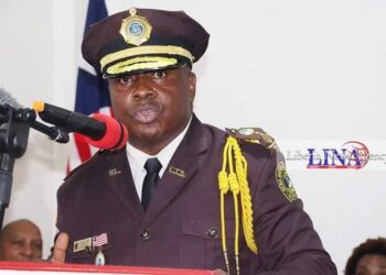 former Commissioner of the Liberia Immigration Service wearing Immigration officer uniform