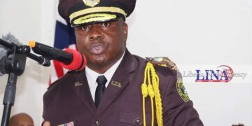 former Commissioner of the Liberia Immigration Service wearing Immigration officer uniform