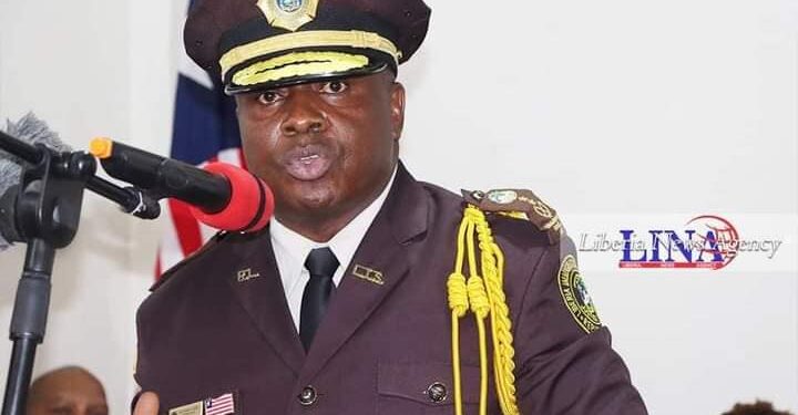 former Commissioner of the Liberia Immigration Service wearing Immigration officer uniform