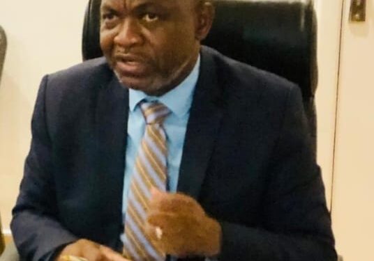 Dr. Maxime Houinato, UN Women Regional Director, speaking at a high-level meeting in Monrovia on empowering Liberian women economically to reduce gender-based violence and promote national development.