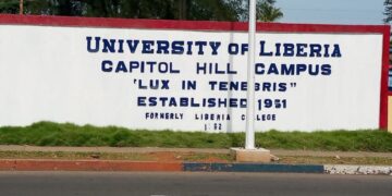 University of Liberia Capitol Hill campus entrance sign reading “Lux in Tenebris” with 1951 establishment date