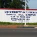 University of Liberia Capitol Hill campus entrance sign reading “Lux in Tenebris” with 1951 establishment date