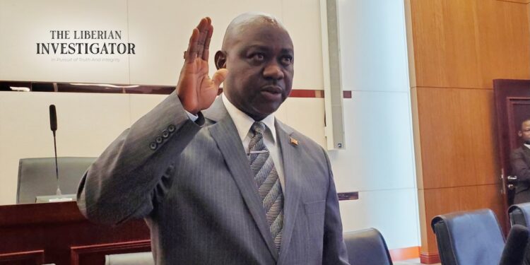 Cllr. Boakai Kanneh raises his hand during his confirmation as Associate Justice of the Supreme Court of Liberia, following a unanimous Senate vote on July 24, 2025.