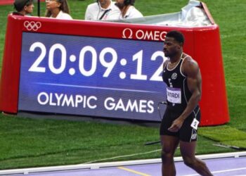 Liberian sprinter Emmanuel Matadi walks off track at the 2024 Paris Olympics after his final race, announcing retirement on Liberia’s Independence Day.