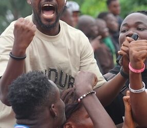 Fans celebrate passionately during a Z-Billion Allstar Tournament match in Paynesville, Liberia — a grassroots football event keeping the sport alive in the off-season.